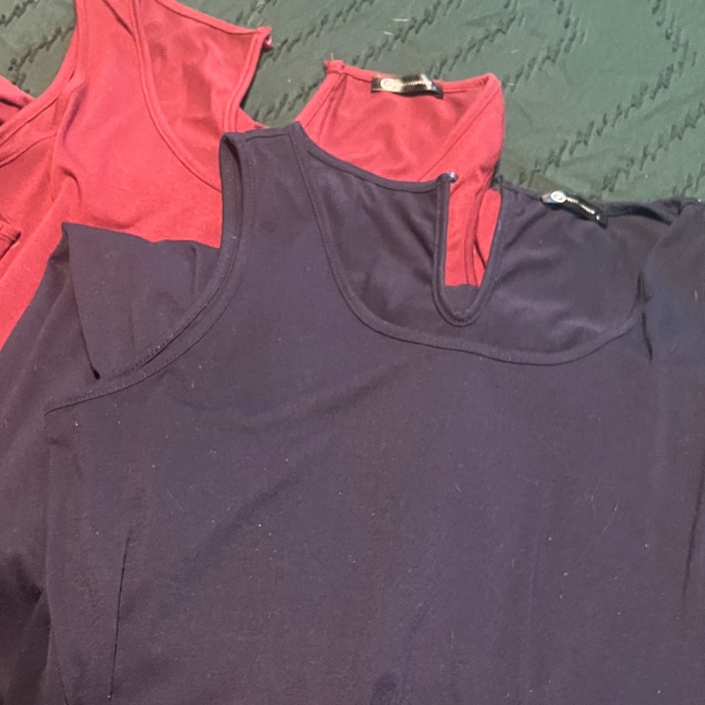 Two sleeveless jumpers with drawstring and pockets